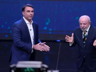 The Latest: Brazilians choose between Lula and Flávio Bolsonaro in presidential runoff