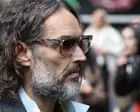 Russell Brand had ‘maniacal grin’ as he dragged woman into toilet and raped her, court told