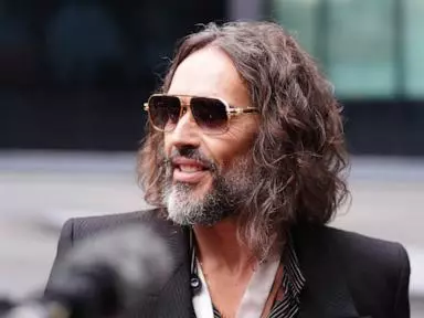 Prosecution labels Russell Brand 'ruthless sexual predator' at opening of trial