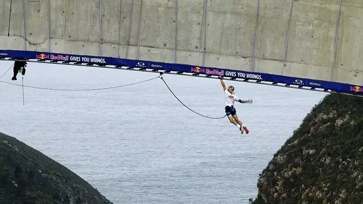 South Africa: Athlete traverses 600 monkey bars under a 216-metre bridge
