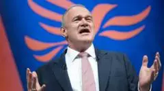 Lib Dems rally behind Davey as he pledges change