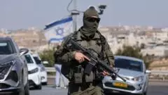 Five Israelis wounded and two suspected Palestinian attackers killed in West Bank shooting
