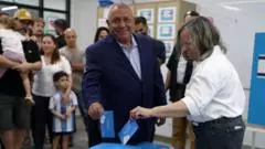 Political rivals, and their wives, vote in Israeli election