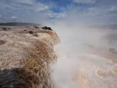 El Niño rains flood South America, sending residents fleeing and cattle swimming