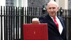 Chancellor holds red box outside No 11