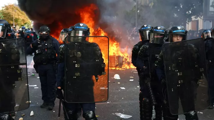 Macron jets out of riot-torn France for Gulf trip as political pressure mounts